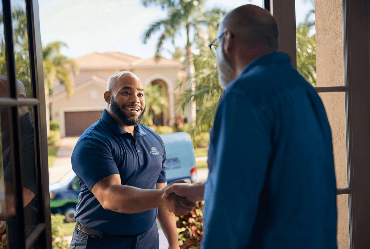 Technician shaking customers hand