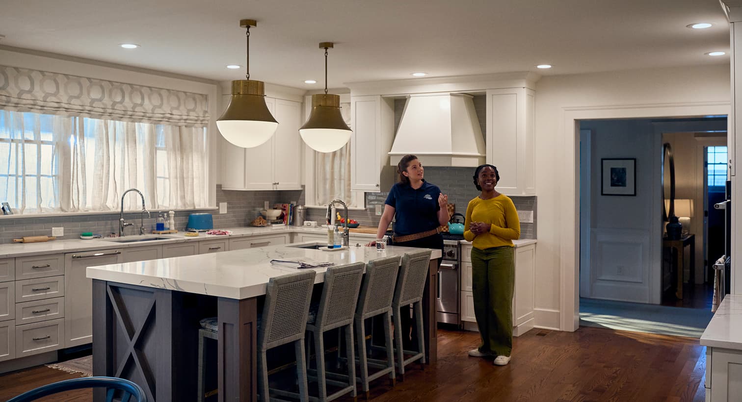 A Sansone electrician consulting with a homeowner about modern residential lighting design and complete home electrical services