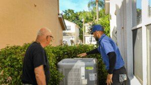 sansone ac technician working with a homeowner to fix a smelly ac unit